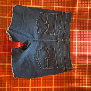 These are Justice shorts the size is a 16 plus the color is a dark blue.